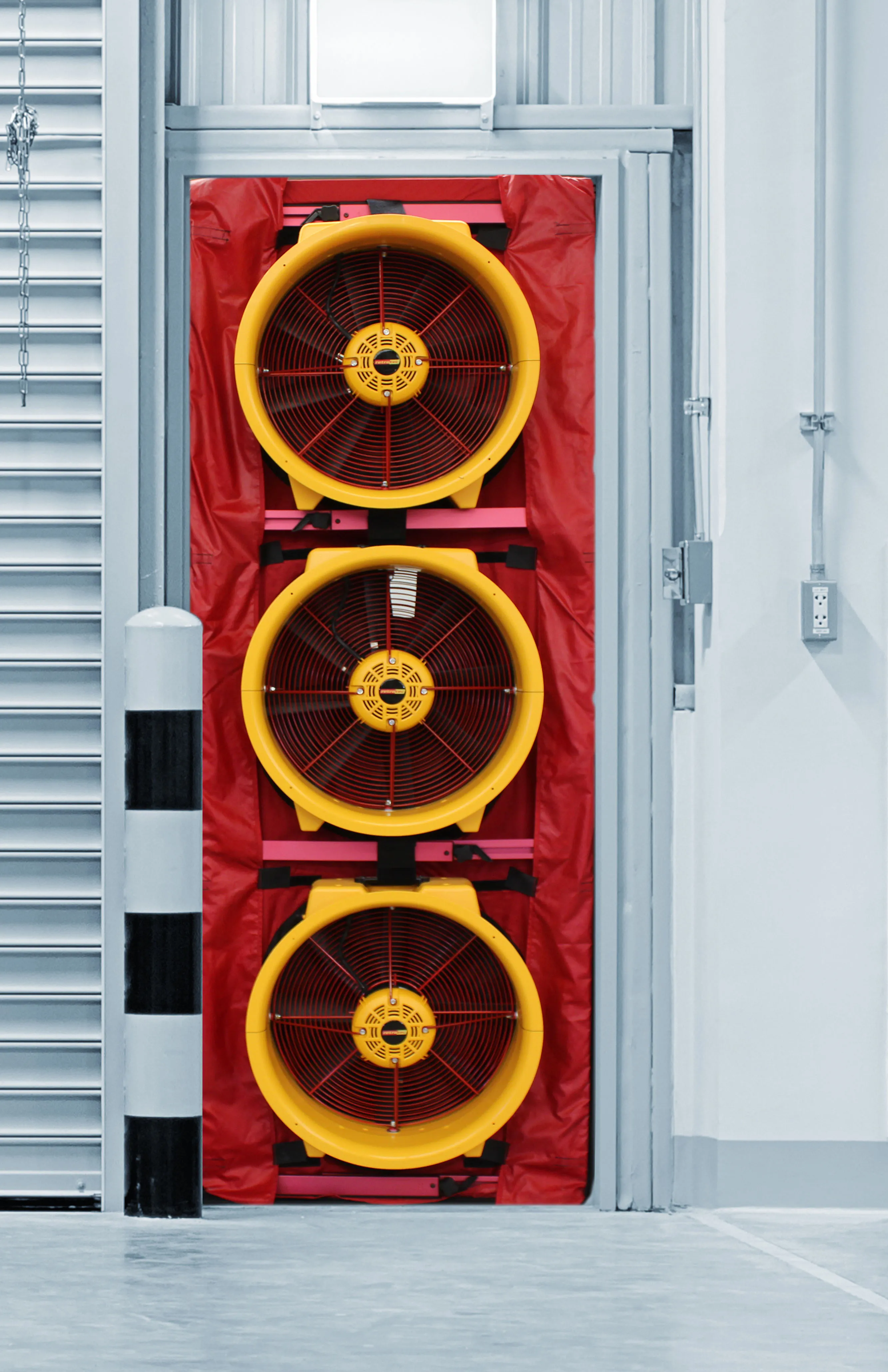 Commercial air leakage testing fan installed in doorway